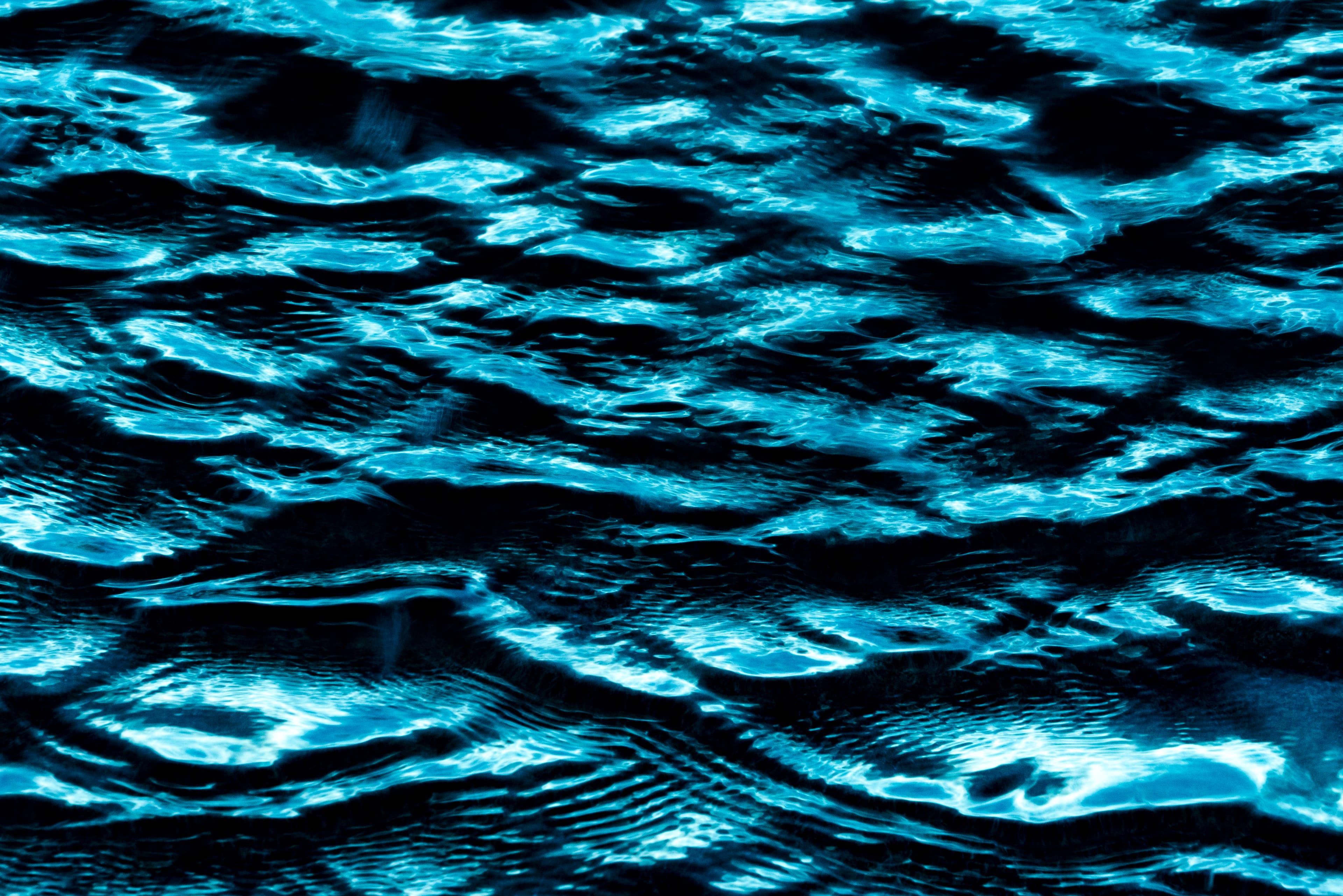 Bright turquoise ripples across the ocean surface — fine art ocean photography print, Whangamata NZ.
