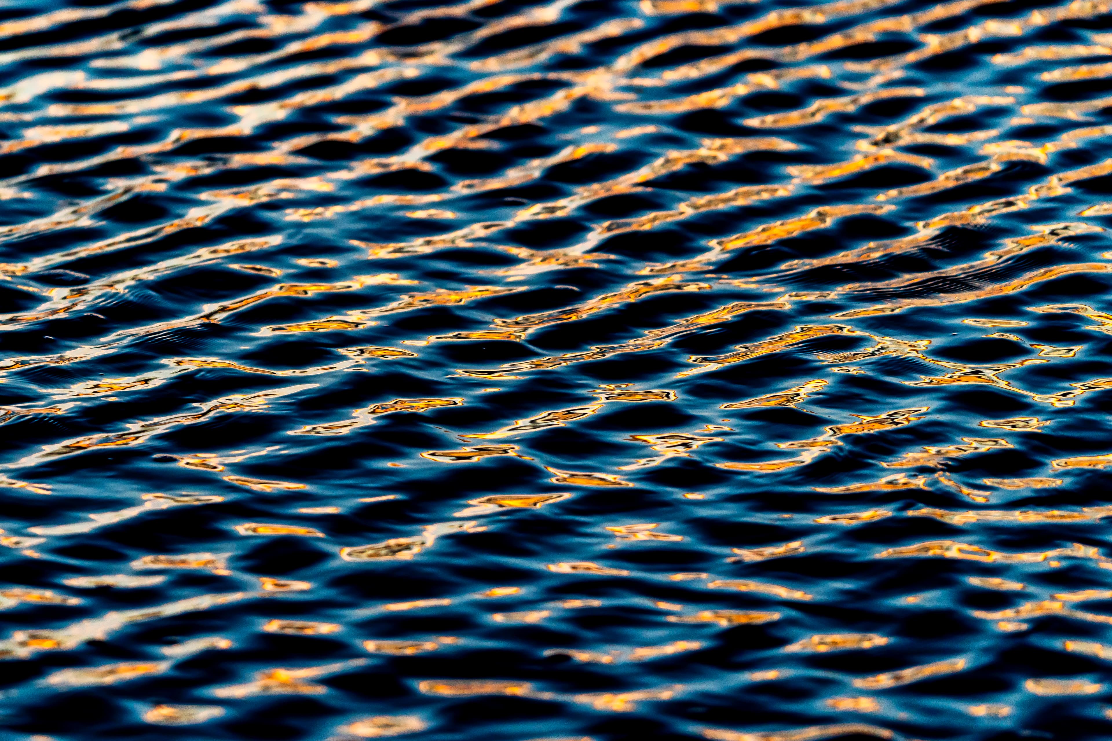 Golden light forming a mesh-like reflection pattern — fine art photography print, Whangamata NZ.