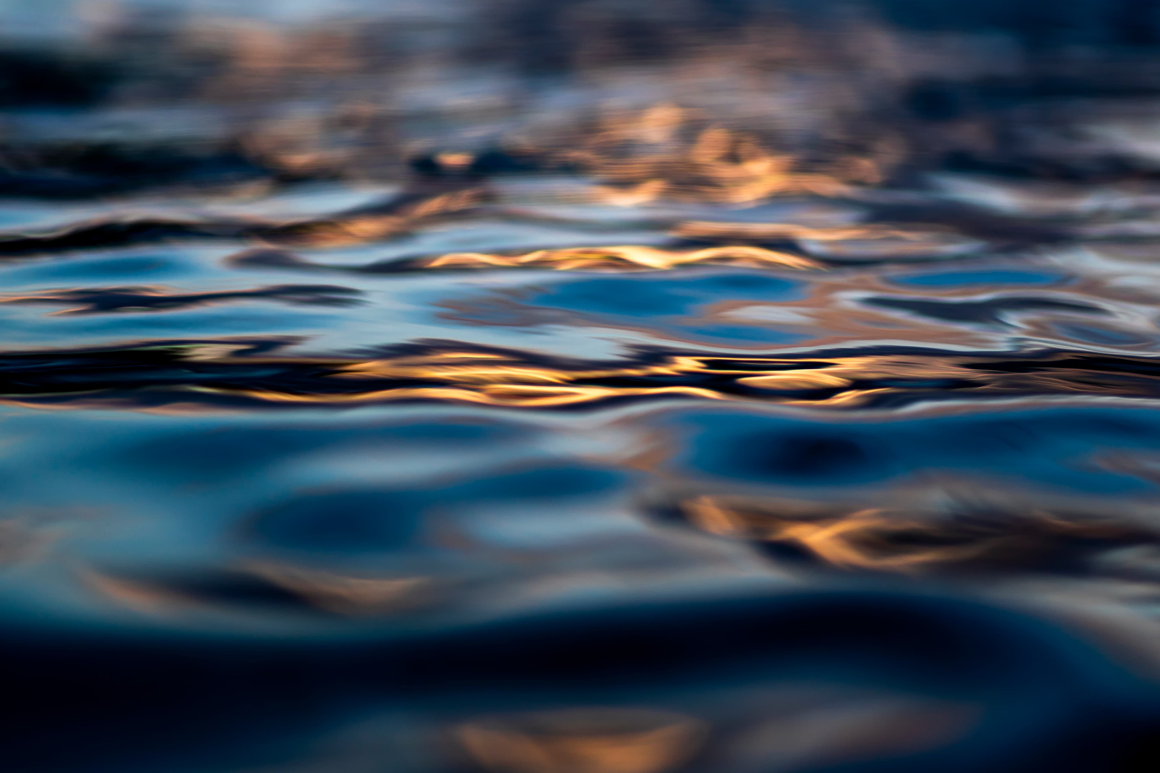 Soft muted blue reflection with a faint gold line — fine art ocean photography print, Whangamata NZ.