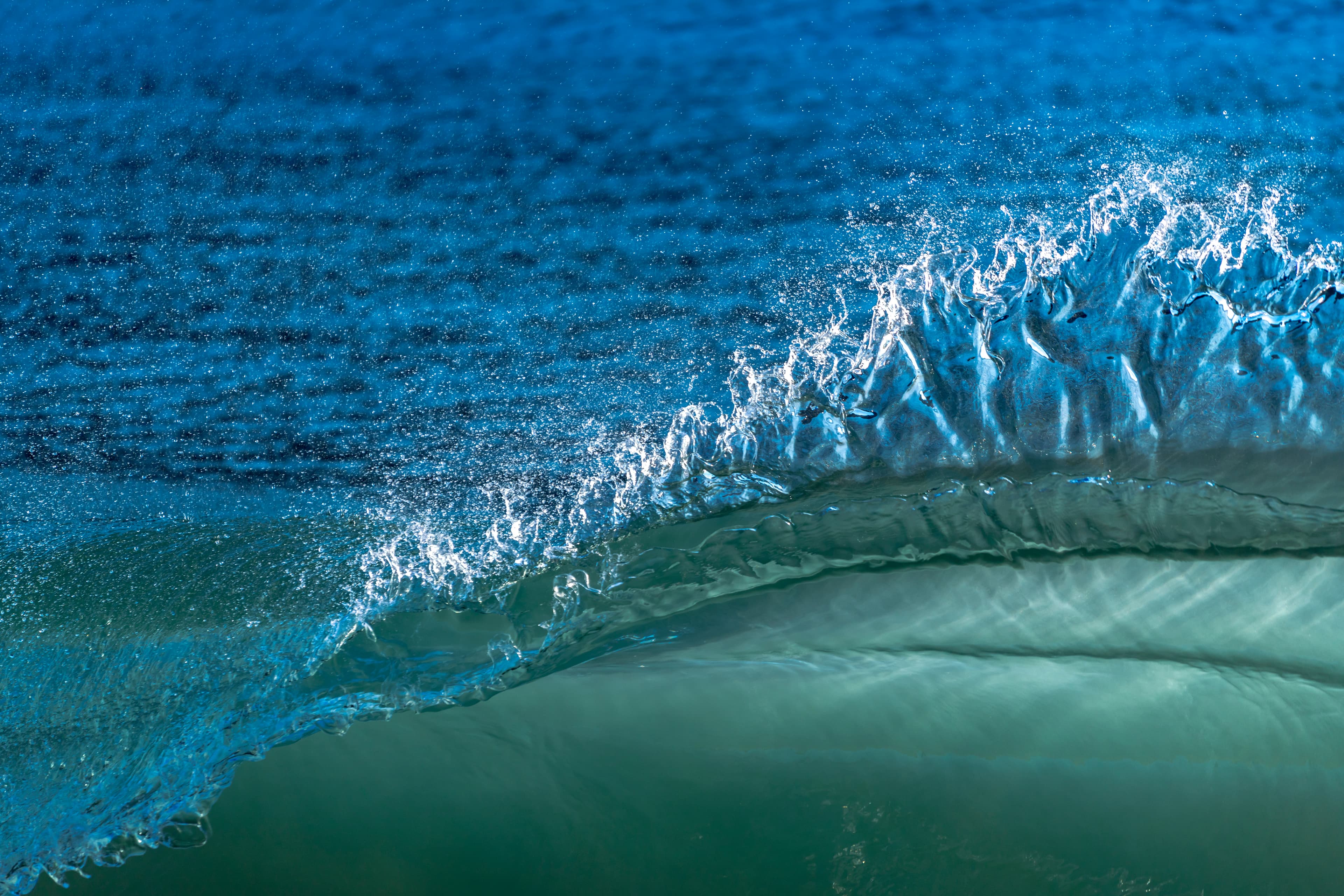 Dynamic spray bursting from a breaking wave — fine art ocean photography print, Whangamata NZ.